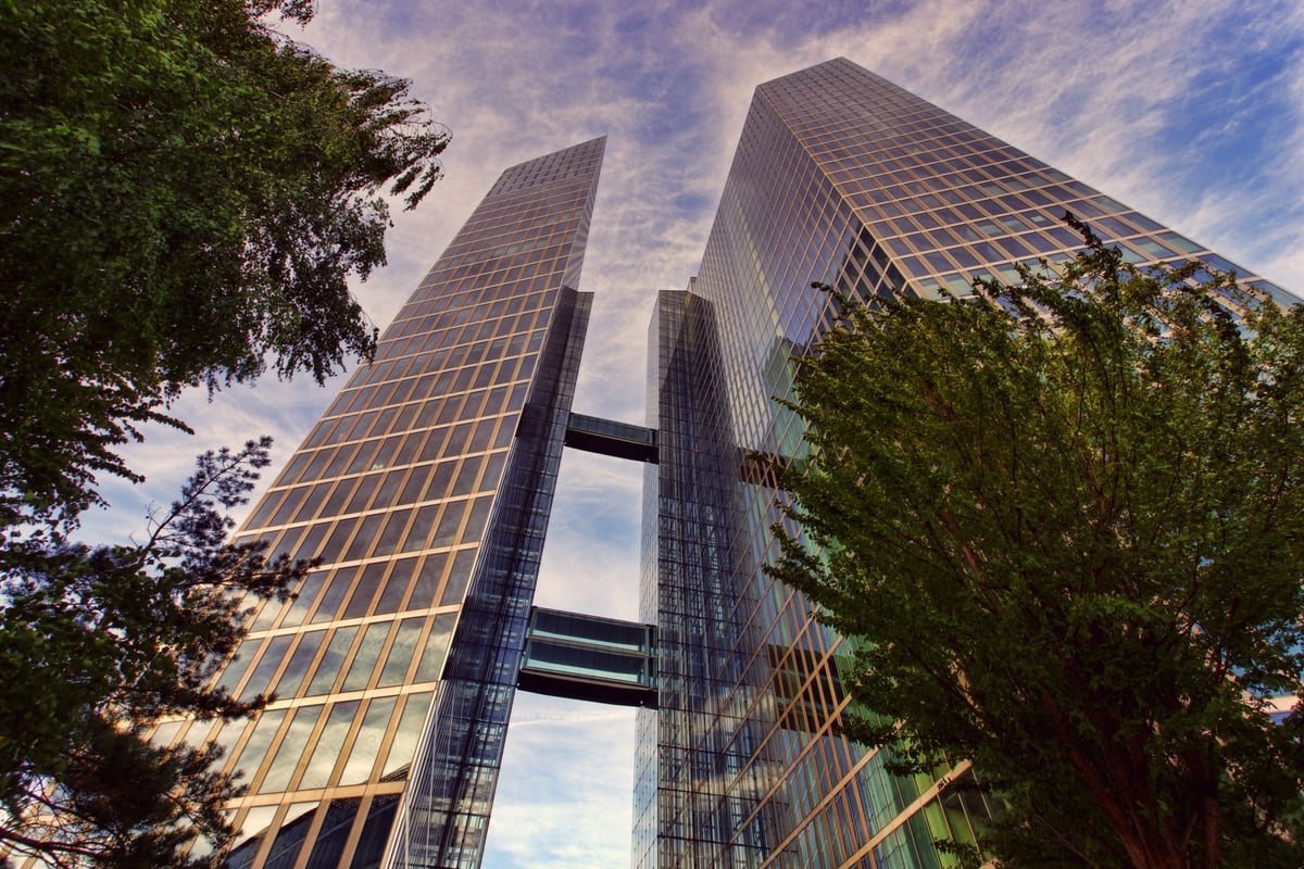 Low Angle Photo of Two Clear Glass Skyscrapers Under Clear Blue Sky